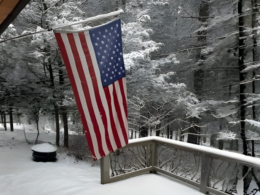 Rustic porch railing in Forestburgh, NY, showcasing deck railing typical of upstate New York, adding a warm and inviting touch to the outdoor area.