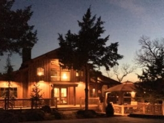Lighted Home Exterior At Dusk