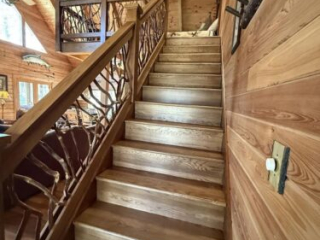 Rustic Mountain Laurel handrail on a loft staircase in a timber home in Gainesville, GA.