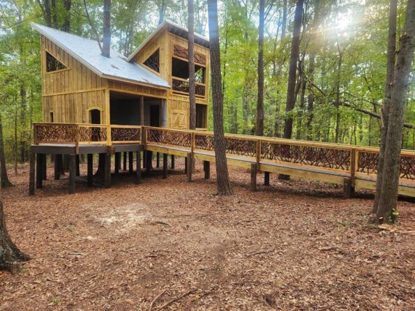 A charming treehouse in Covington, GA, featuring Mountain Laurel handrails, designed to enhance safety and aesthetic appeal in a natural setting.