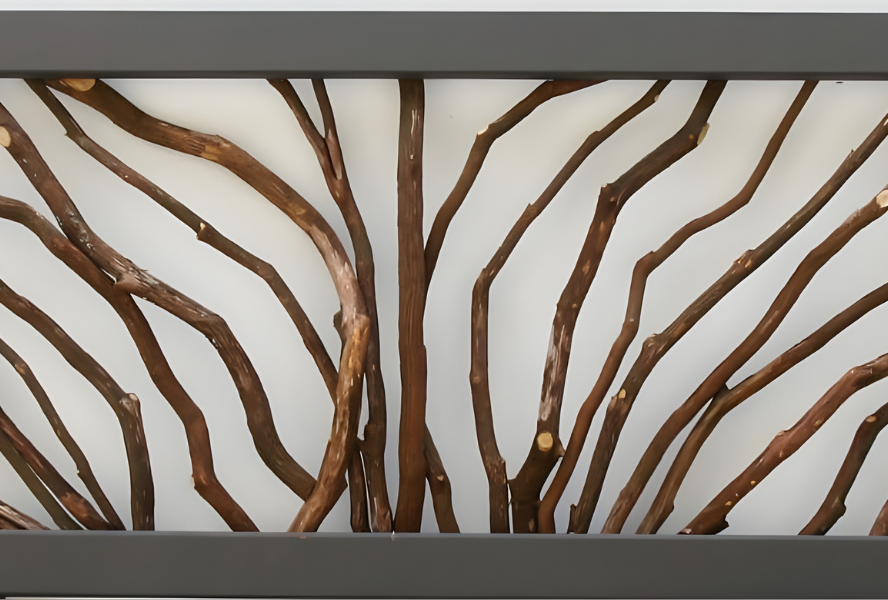 Close-up of a Woven Branch Decorative Panel crafted from natural twigs in a tree-inspired pattern against a light background, bordered by dark metal framing.