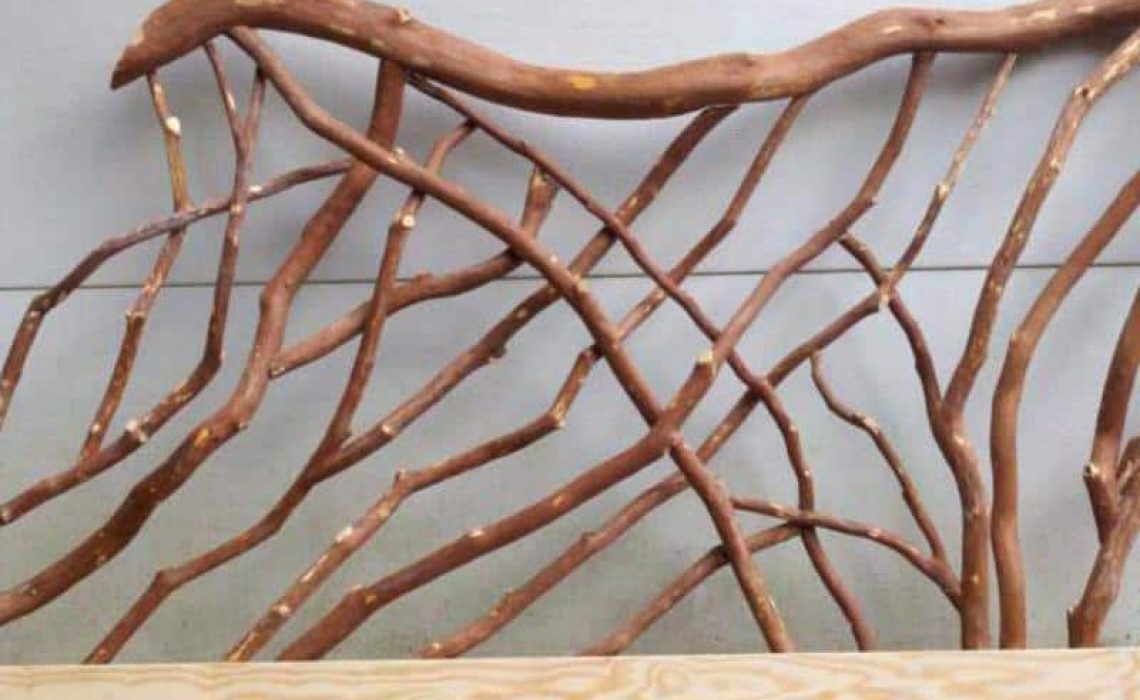 A product photo of a branch banister handrail featuring thin Mountain Laurel branches, showcasing its natural design.