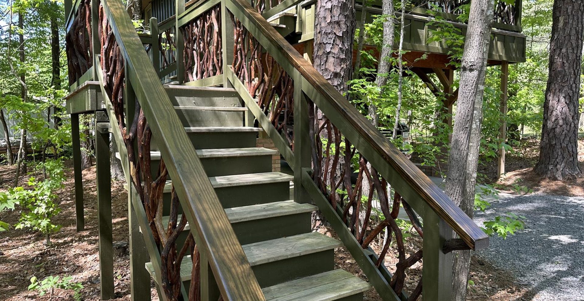 Green stair handrails made from mountain laurel branches in Asheville, NC, showcasing natural beauty and craftsmanship.