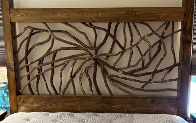Spiral-designed bed frame made from mountain laurel branches, showcasing natural beauty and craftsmanship.