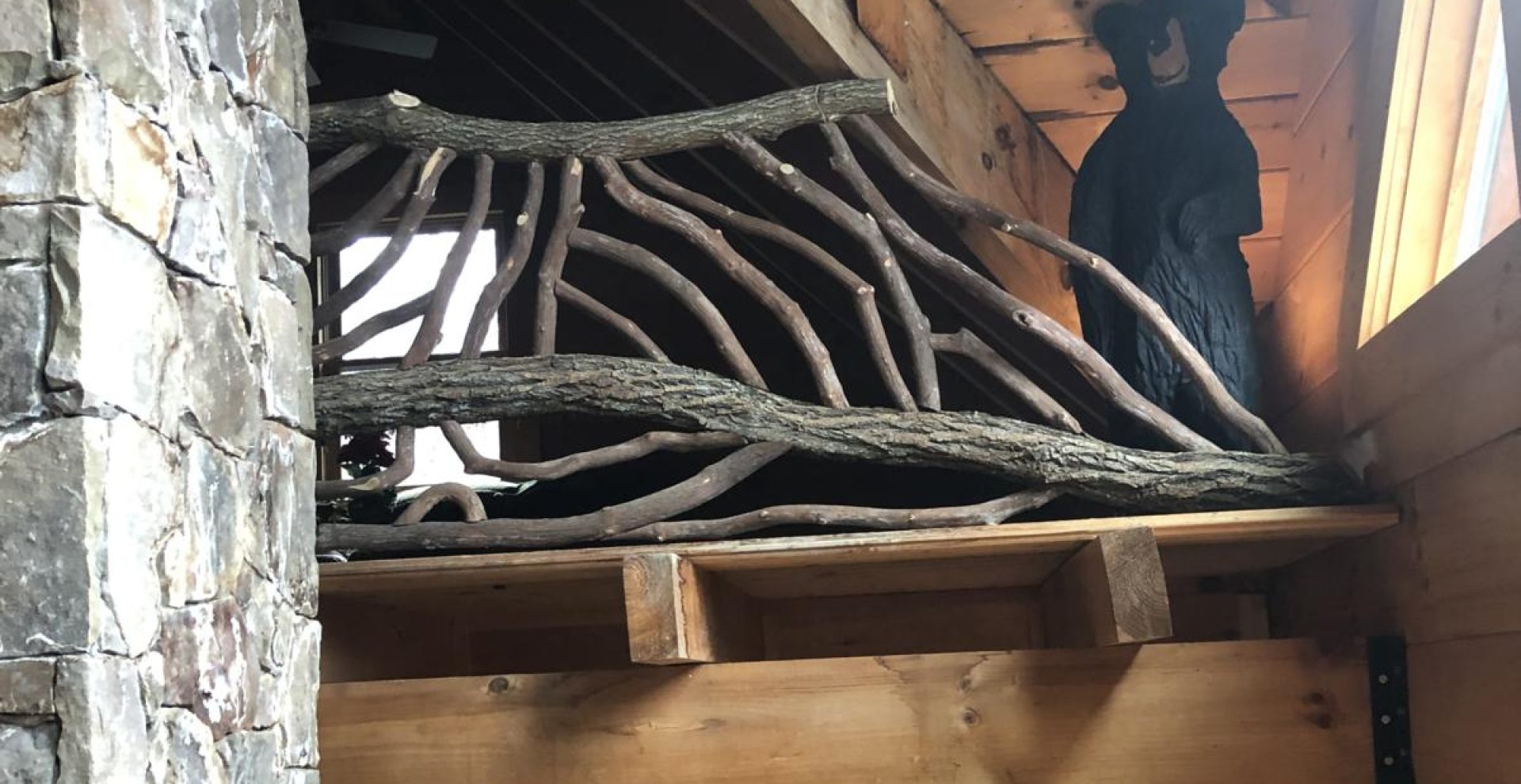 Exquisite woodwork featuring curved locust and laurel branches, showcasing fine craftsmanship for elegant home decor.