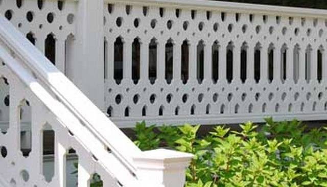A unique railing design showcasing modified ovals centered between rows of varying diameter circles and half-circles, exemplifying innovative deck railing designs.