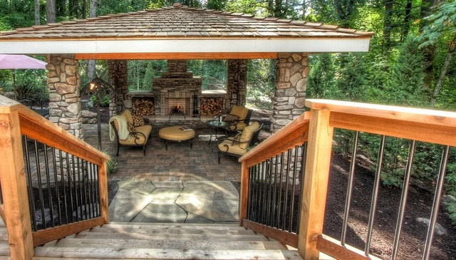 A distinctive railing design featuring turned 2x4 rails on edge with stock metal pipe balusters.