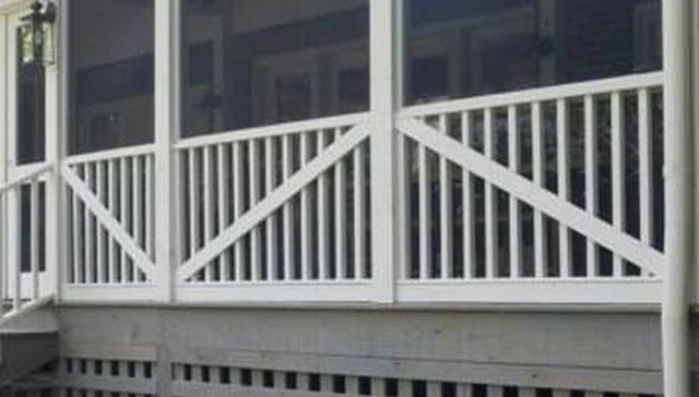 Deck railing featuring sleek 2x2 vertical posts intersected by a bold diagonal board, creating an eye-catching strikethrough pattern from post to post for deck railing design.