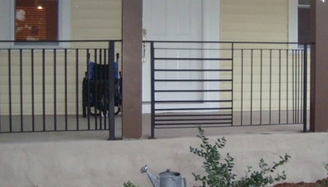 A unique railing design featuring gradient style metal balusters with alternating panels rotated 90 degrees.