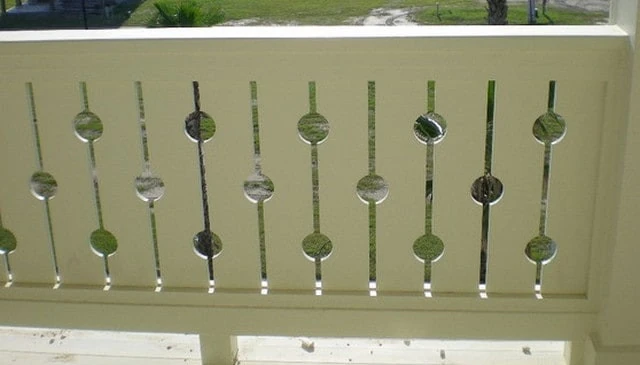 A porch railing design featuring alternate circles in line, creating a modern and stylish aesthetic for deck railing designs.
