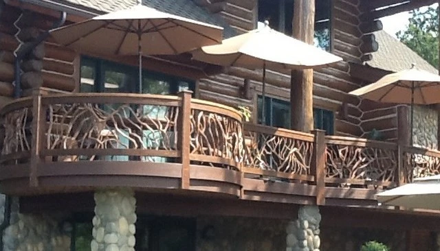 A curved railing design for decks showcasing a break from standard straight lines, exemplifying enhanced aesthetic appeal in outdoor design.