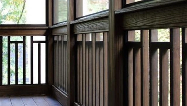 A craftsman style wood deck design showcasing vertical 2x2s with horizontal spaces below the top rail, exemplifying a stylish element of space in outdoor design.