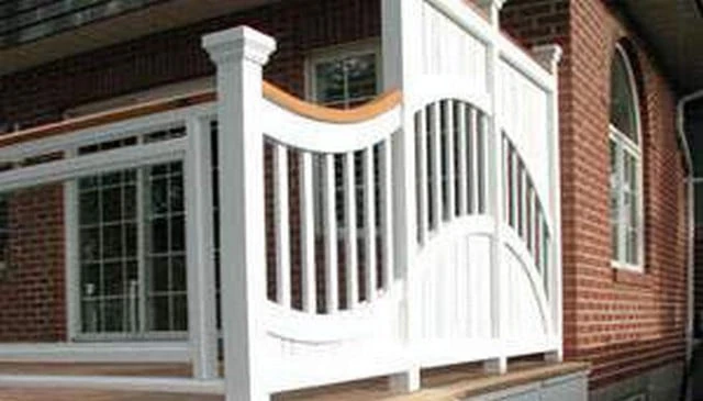 A modern curved fence design showcasing graceful undulating panels that enhance privacy and aesthetic appeal exemplifying contemporary outdoor solutions.