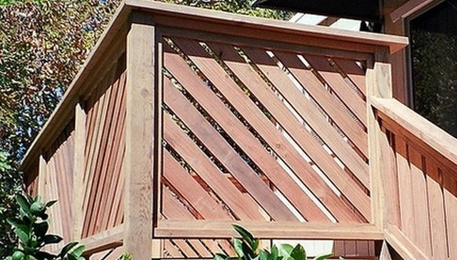A distinctive intersecting wooden slats railing showcasing a dynamic diagonal pattern that enhances decks and patios exemplifying unique deck railing designs.