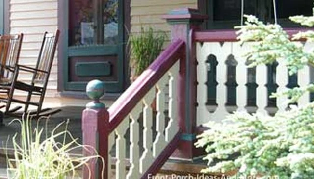 A striking porch stair railing showcasing multi-colored sawn balusters in modified oval shapes exemplifying unique deck railing designs.