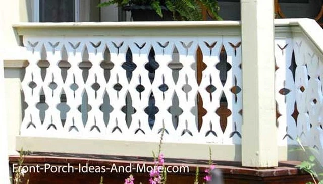 A fanciful gingerbread architectural style porch handrail showcasing multiple cross shapes, adding decorative appeal to outdoor spaces.
