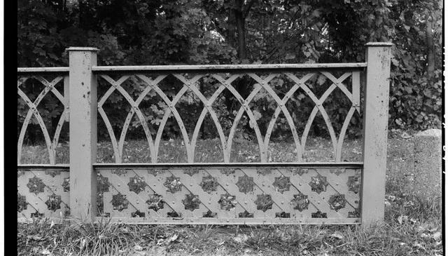 A gothic style metal railing featuring intricate designs with pointed arches and ornate details, enhancing the architectural beauty of outdoor spaces.