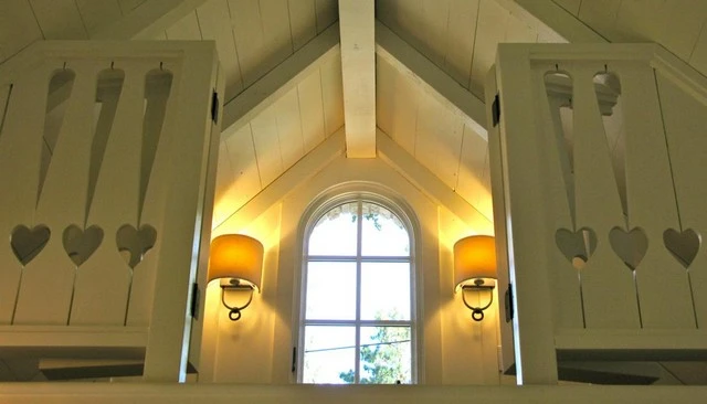 A heart exclamation point balcony handrail design showcasing sawn balusters with unique patterns, adding a personalized touch to outdoor spaces.