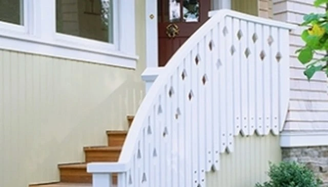 A sawn baluster stair handrail featuring alternating height diamonds attached to the stair stringer, creating a distinctive and artistic design.