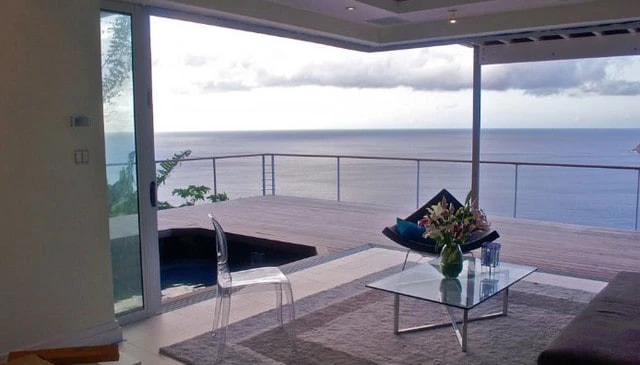 A sleek minimalist cable railing design by Keuka Studios, providing unobstructed views and modern elegance for outdoor spaces.