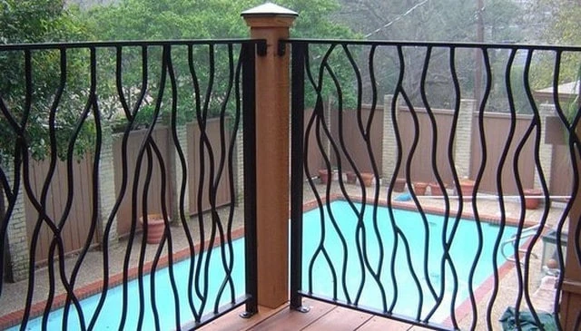 An intertwined sinuous metal railing design inspired by the natural organic shapes of rustic wood branch railing, showcasing innovative deck railing designs.