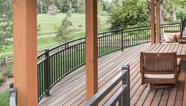 A simple variation on vertical baluster style featuring a double top rail with a midspan connection and two small vertical balusters, showcasing innovative deck railing designs.