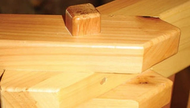 A beautifully crafted no nails wooden railing featuring a tongue-in-fork slip joint design, showcasing master craftsmanship and an authentic aesthetic