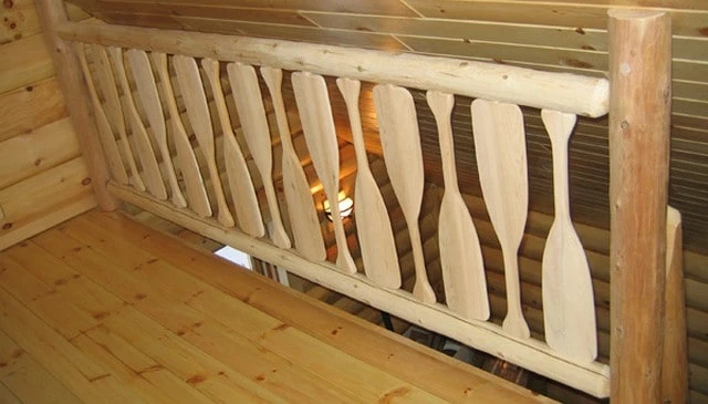A decorative railing design featuring oars with attractive spacing and curves, ideal for canoe and kayak enthusiasts