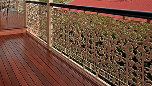 A stunning ornamental wrought iron handrail design featuring intricate patterns with minimal open space for maximum visual impact