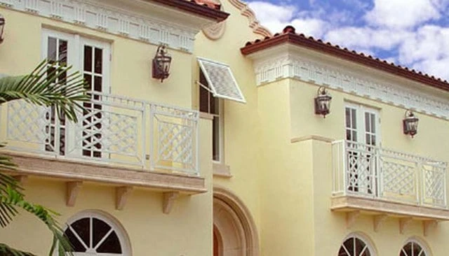 A decorative deck lattice design featuring Palm Beach Caribbean Chippendale style with framed metal diamond lattice and small verticals above