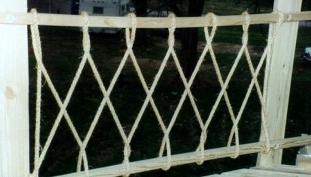 Whimsical rope diamond pattern featuring a twisted design on a pressure treated frame, ideal for treehouse railing design.
