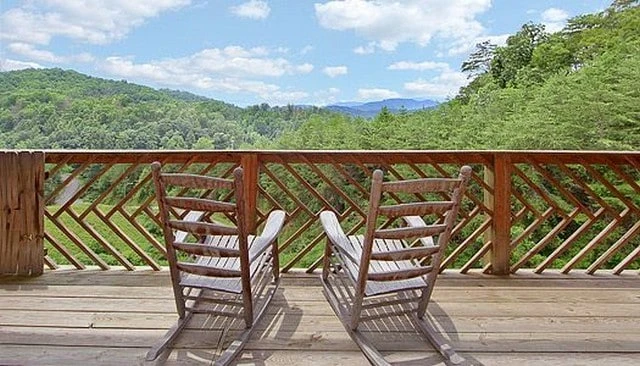 Diagonal arrow wood deck railing featuring an eye-catching geometric pattern, enhancing the aesthetic of outdoor spaces for unique deck railing design.