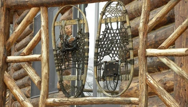 Snowshoe railings designed for snowshoers, featuring vintage snowshoes with the option to mix in new ones for creative deck railing design.