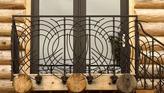 Circular metal railing design showcasing interesting geometry and complex connections between pieces for unique deck railing design.