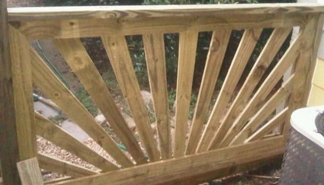 Enhanced pressure treated sunburst railing featuring tapered 1x4 boards milled for wider outer edges and narrower center, creating a striking visual effect for deck railing design.