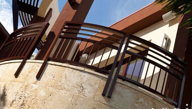 Square metal pipe railings featuring vertical balusters below triple horizontal top rails on a curved stone balcony, ideal for contemporary deck railing design.