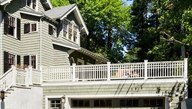 Wooden deck design featuring typical baluster spacing with triple horizontal pieces, creating a partial lattice effect for deck railing design.