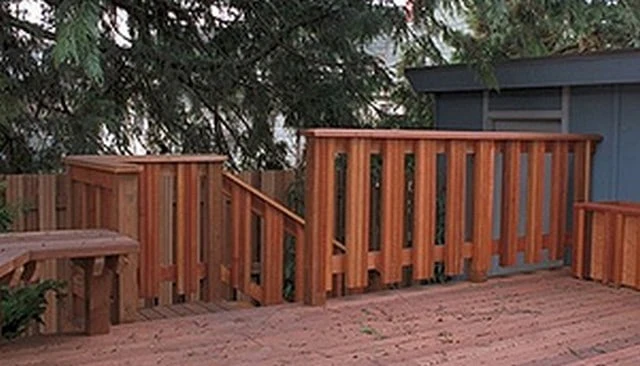 Triple stacked vertical 2x2 railing design featuring a striking visual rhythm and clean architectural appeal for deck railing design.