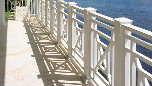 Custom tropical porch X railing design featuring intersecting bars and geometric squares, adding modern architectural interest for deck railing design.