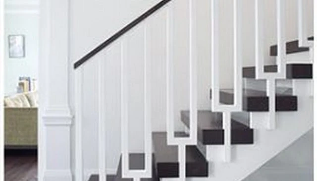 Stair railing design inspired by musical tuning forks, featuring elegant prongs extending from the main handrail for a unique aesthetic.