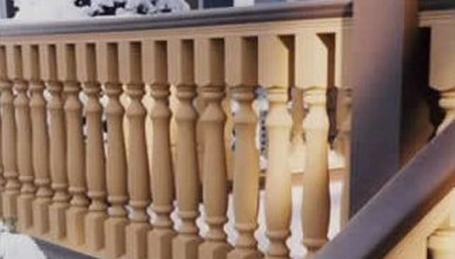Ornate turned balusters featuring multiple flutes and spare curves, creating an elegant spindle design for refined outdoor spaces.