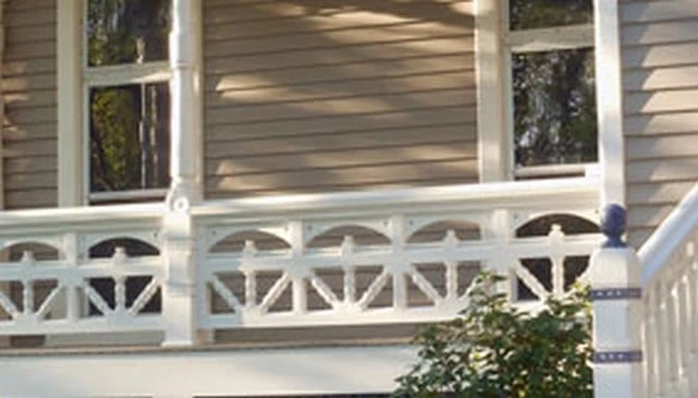 Victorian porch railing featuring a multiple sunburst design with three-pronged parts and arcs in a post-to-post section, ideal for classic deck railing designs.
