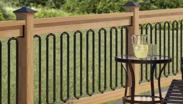 Black iron oval pipe shapes designed to resemble vertical balusters, featuring easy installation and comforting curves for deck railing designs.