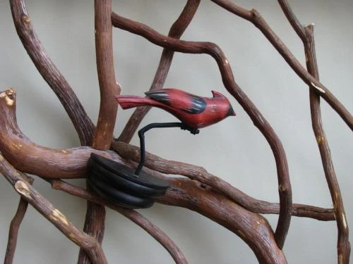 Carved Cardinal Mounted to Railing
