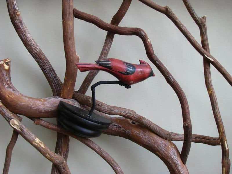 Carved Cardinal Mounted to Railing