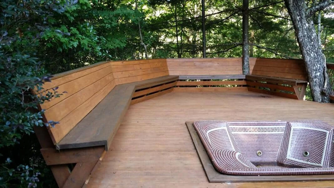 Mountain laurel handrails on a deck patio featuring a built-in hot tub