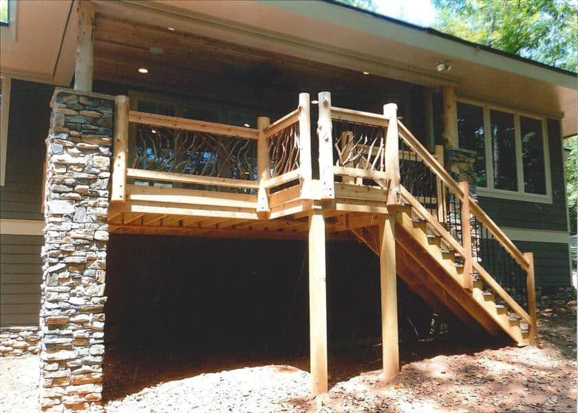 A close-up view of a cedar deck railing post illuminated by sunlight, showcasing its natural beauty and craftsmanship.