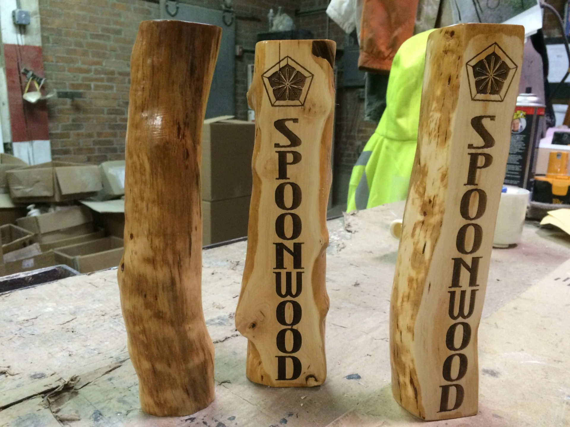 A beautifully crafted tap handle for Spoonwood Brewery, made from Mountain Laurel wood, showcasing its unique grain and design.