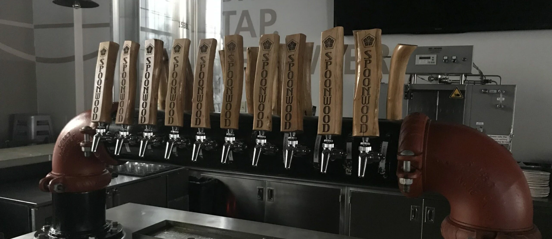 A custom tap handle made entirely from Mountain Laurel, showcasing its unique design and craftsmanship, ready for use.