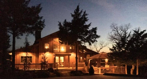 Lighted Home Exterior At Dusk